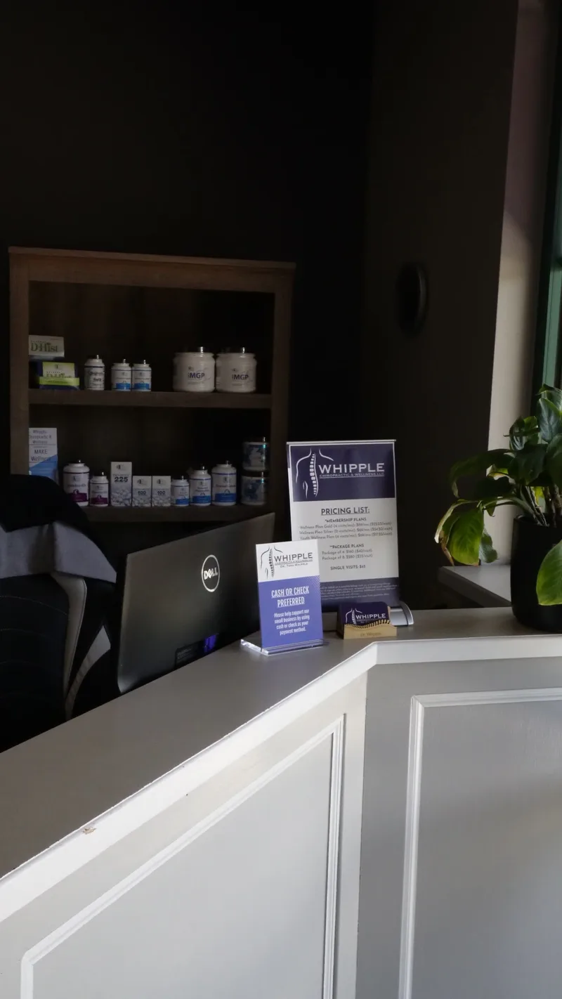 Reception desk with Whipple sign and product shelves