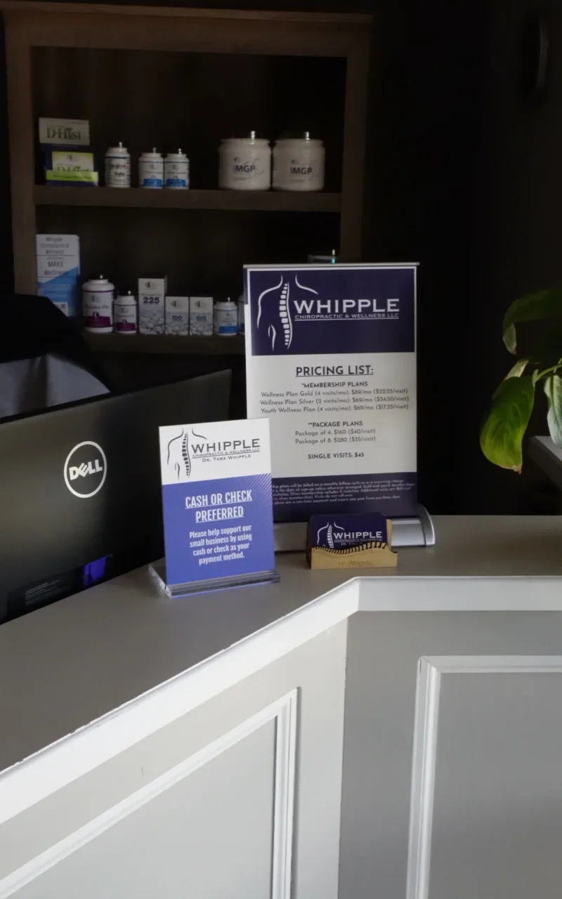 Whipple Chiropractic reception desk with pricing list