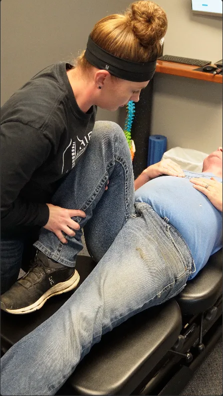 Dr. Whipple assessing a patient's hip and leg movement